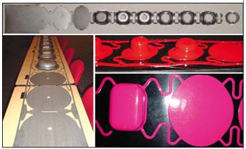 Close-up photograph of progressive die strip showing pilot holes, formed stations, and connected metal carriers