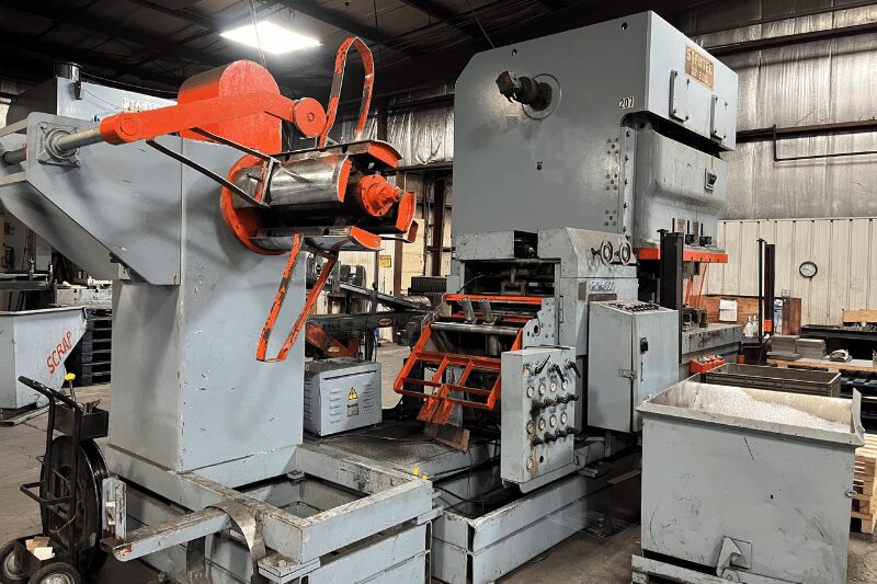 Industrial stamping press photographed in a manufacturing facility for sheet metal production