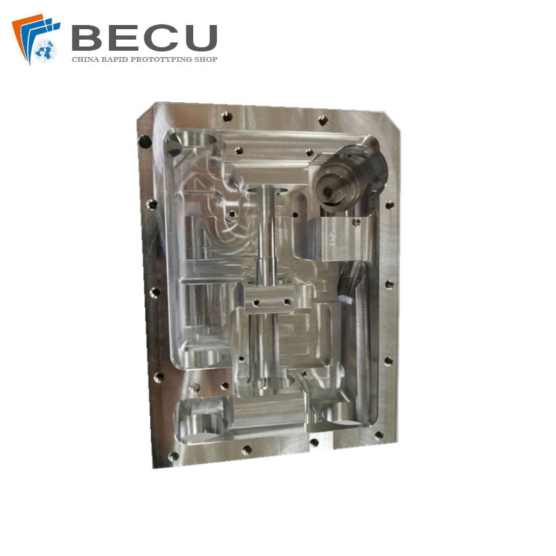 Machined aluminum housing with complex pockets and five-axis milling features displayed in a manufacturer case-study photograph