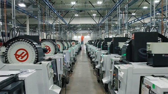 CNC machining center aisle inside Protolabs manufacturing facility with multiple industrial milling machines