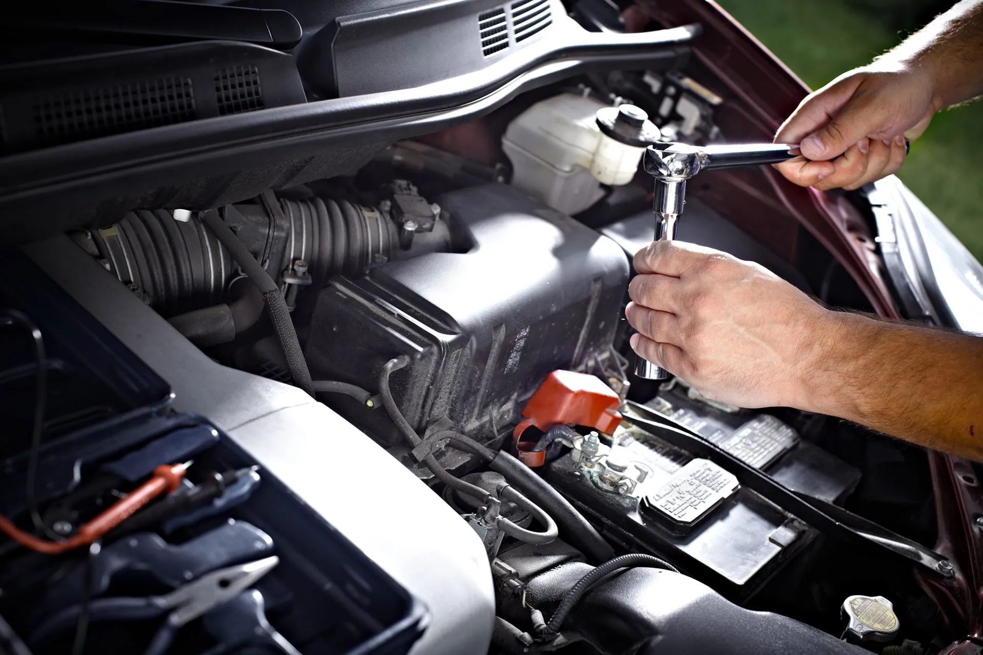 Technician applies controlled torque with a wrench to verify fastener performance in an industrial assembly process