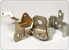 Custom stamped metal brackets and mounting clamps